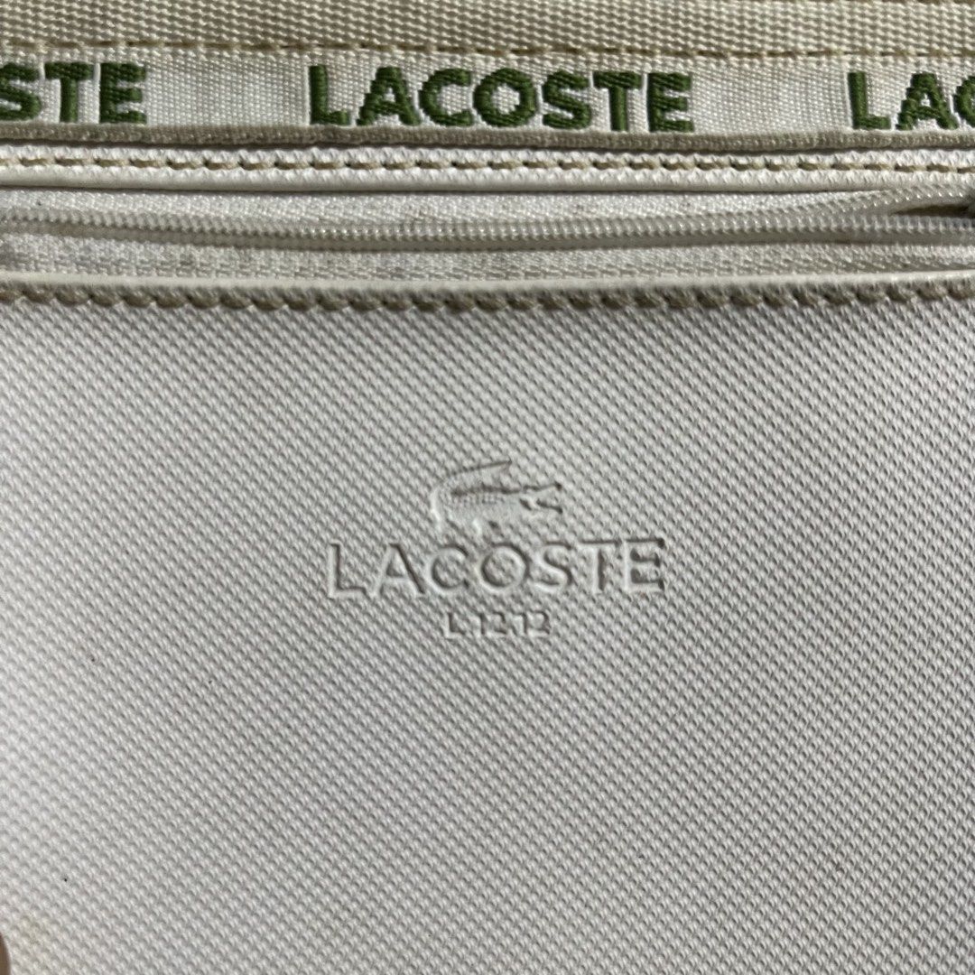 Lacoste (Category: Tote Bags) located in Quezon City. Submitted by thriftshop_treasure (Listing ID 1461510424, Image 3). Description: Lacoste 13 length 16 wide .