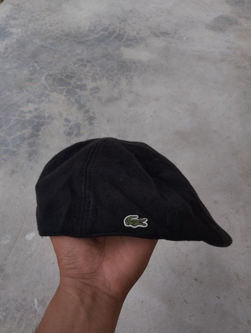 Lacoste Black Flat Cap Hat (Category: Caps & Hats) located in Mati. Submitted by old_era.ph (Listing ID 1461460409, Image 1). Description: - Classic black flat cap by Lacoste - Features iconic embroidered crocodile logo on the side - Made from comfortable material - Perfect for everyday wear - Adds a stylish and versatile touch to any outfit.
