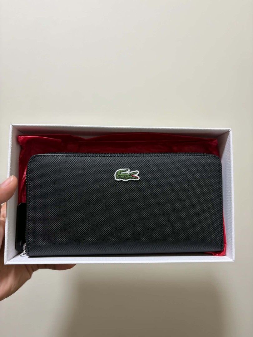 Lacoste Black Zip Around Wallet (Category: Wallets & Card holders) located in Manila. Submitted by kpfcarts (Listing ID 1461365185, Image 2). Description: - Classic black Lacoste wallet - Secure zip-around closure - Ample space for cards and cash - Comes with original box and dust bag - Ideal for everyday use or as a gift.