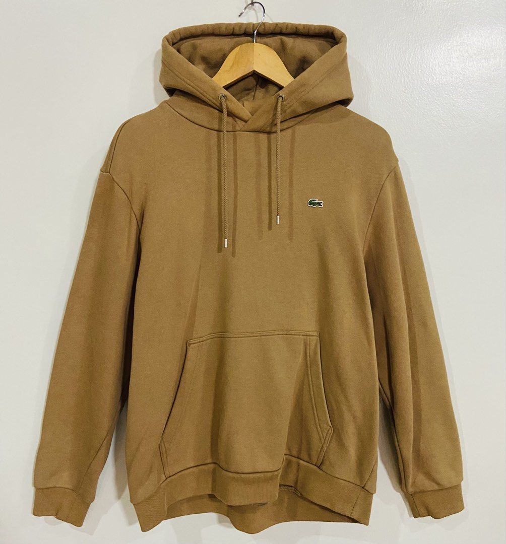 Lacoste Hoodie Tan Brown (Category: Hoodies) located in Manila. Submitted by thriftnijuan08 (Listing ID 1461344152, Image 1). Description: - Tan brown Lacoste hoodie - Size: US L / FR 5 - Classic crocodile logo on chest - Drawstring hood with metal aglets (Lacoste branded) - Front kangaroo pocket - Ideal for casual wear -Dimes 24/27.