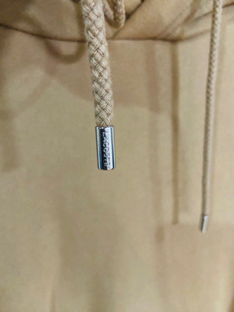 Lacoste Hoodie Tan Brown (Category: Hoodies) located in Manila. Submitted by thriftnijuan08 (Listing ID 1461344152, Image 3). Description: - Tan brown Lacoste hoodie - Size: US L / FR 5 - Classic crocodile logo on chest - Drawstring hood with metal aglets (Lacoste branded) - Front kangaroo pocket - Ideal for casual wear -Dimes 24/27.