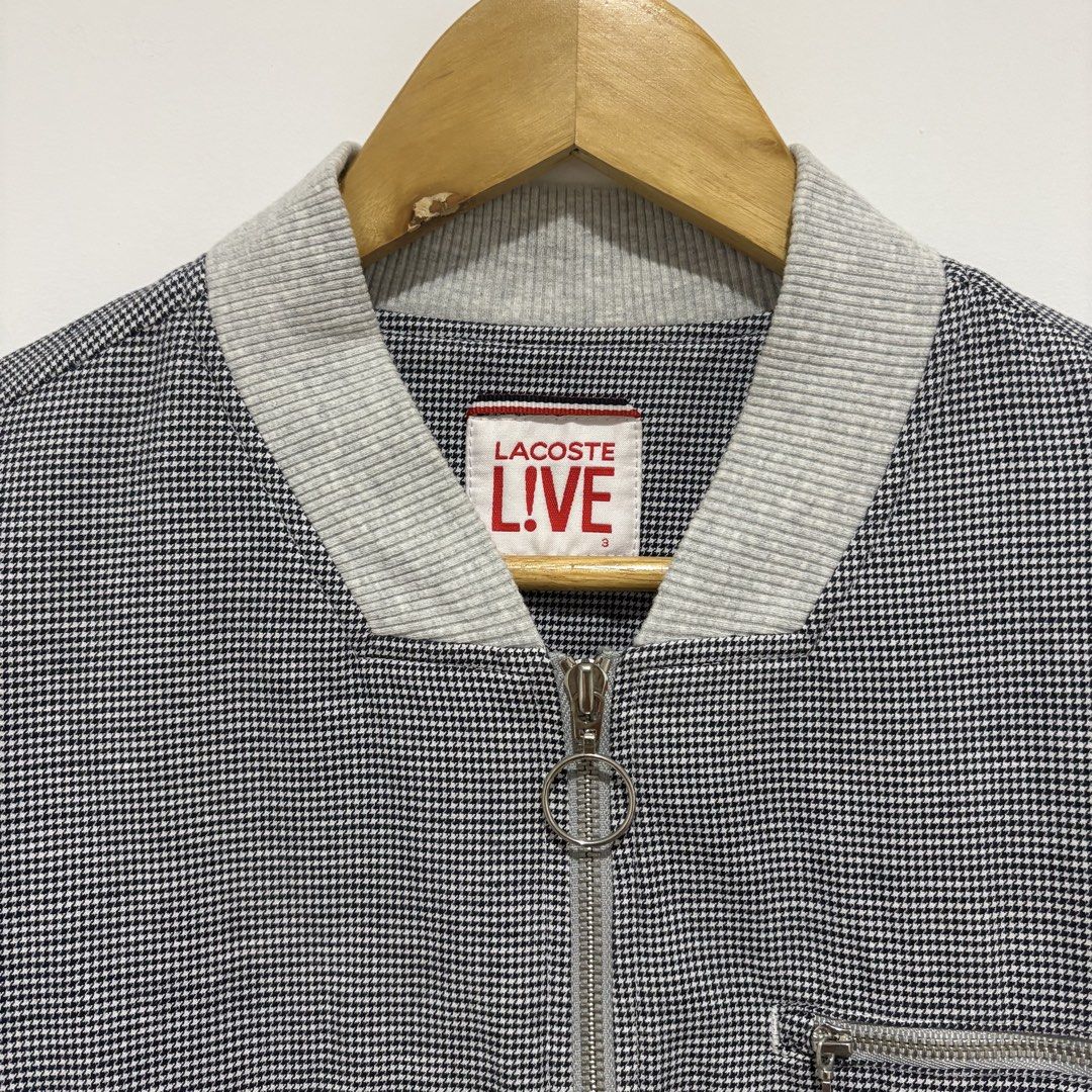 Lacoste Live Bomber Jacket Houndstooth Pattern (Category: Coats, Jackets and Outerwear) located in Dapitan. Submitted by payt3es_thrift. (Listing ID 1461498286, Image 3). Description: LA-COS-TE L!VE HOUNDSTOOTH BOMBER 🐊🔥 Rare-looking La-cos-te L!VE piece in a classic black & white houndstooth pattern. Clean minimalist design with gray ribbed details, multiple zipper pockets and signature crocodile embroidery. Details: • La-cos-te L!VE • Style C