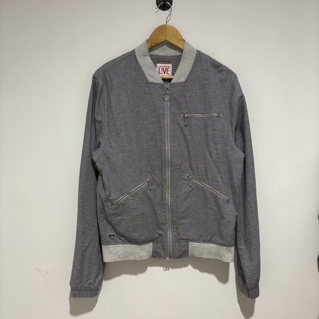 Lacoste Live Bomber Jacket Houndstooth Pattern (Category: Coats, Jackets and Outerwear) located in Dapitan. Submitted by payt3es_thrift. (Listing ID 1461498286, Image 1). Description: LA-COS-TE L!VE HOUNDSTOOTH BOMBER 🐊🔥 Rare-looking La-cos-te L!VE piece in a classic black & white houndstooth pattern. Clean minimalist design with gray ribbed details, multiple zipper pockets and signature crocodile embroidery. Details: • La-cos-te L!VE • Style C