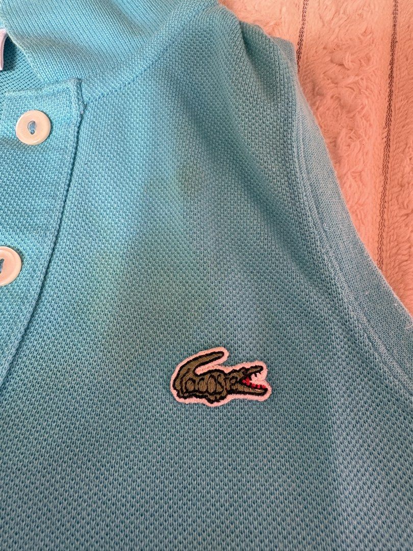 Lacoste Polo Shirt - Blue 5-7T (Category: Babies & Kids Fashion) located in Cavite. Submitted by -coffeebean- (Listing ID 1461336714, Image 1). Description: - Classic blue Lacoste polo shirt - Features iconic crocodile logo on chest - Made from comfortable pique cotton - Two-button placket - Ideal for casual wear or a sporty look - with washable stain.
