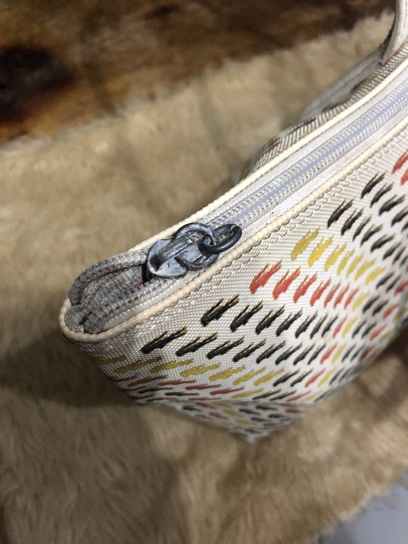 LACOSTE PVC Tote Bag (Category: Tote Bags) located in Quezon City. Submitted by bettymeir07 (Listing ID 1461545453, Image 3). Description: White Lacoste PVC tote bag with an all-over multicolored crocodile logo pattern and dual shoulder straps. -Has issues with straps design, broken zipper, spilled ink inside the bag -Well used condition -PRICE NEGOTIABLE MOP: GOTYME or GCASH.