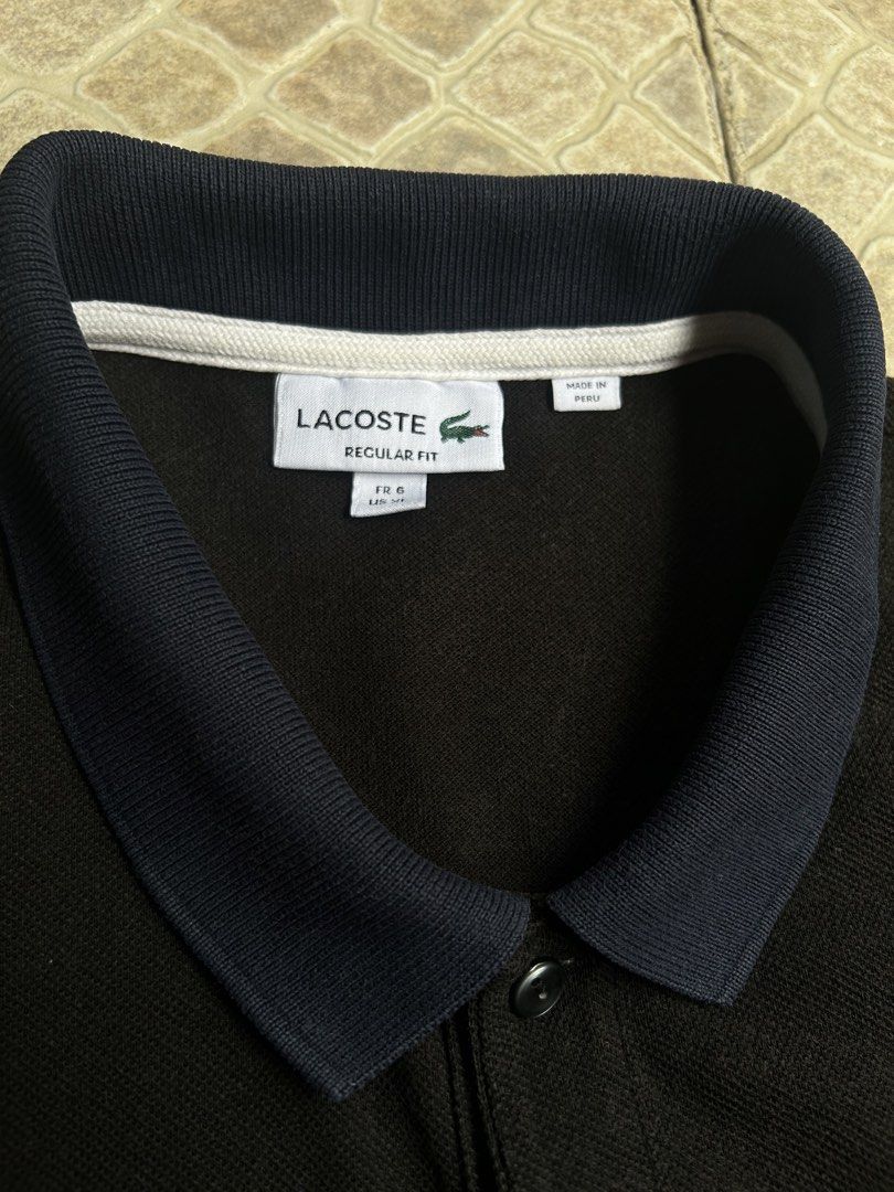 Lacoste Regular Fit Polo Shirt Black (Category: Tshirts & Polo Shirts ) located in Pasay City. Submitted by deguzmanjay (Listing ID 1461517246, Image 3). Description: - Classic black Lacoste polo shirt - Regular fit - Iconic crocodile logo on chest - Contrasting navy collar and sleeve cuffs - Button-up neckline - Made in Peru - Ideal for casual or smart-casual outfits.