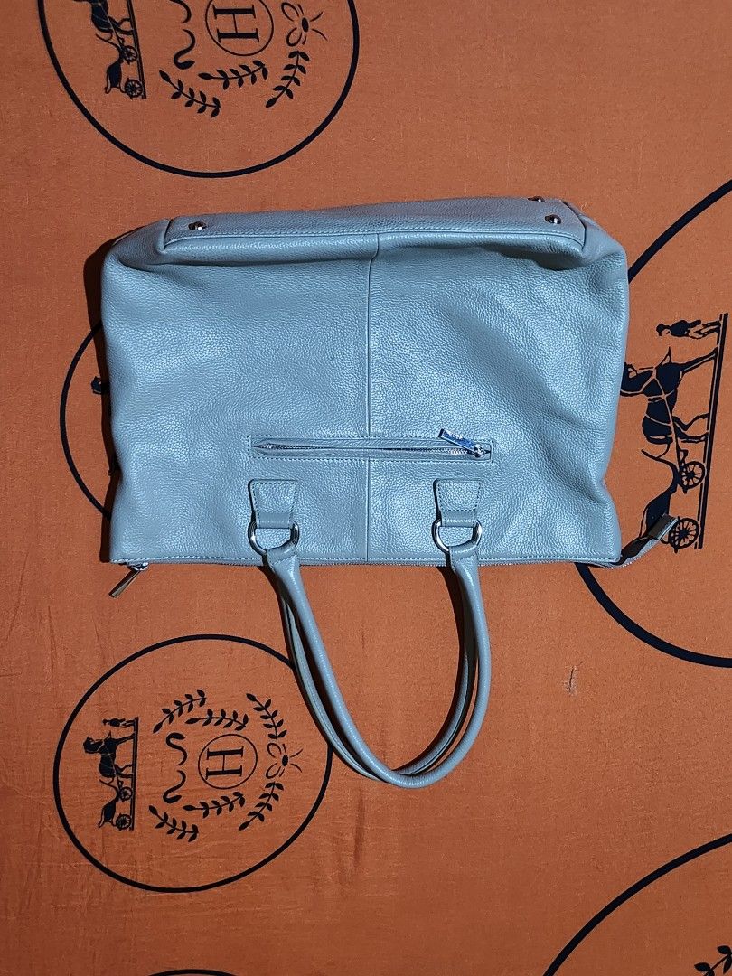 LAZY SUSAN Grey Leather Tote Bag (Category: Tote Bags) located in Caloocan City. Submitted by boldmoon_306f32 (Listing ID 1461509655, Image 1). Description: Selling an authentic Lazy Susan (Japan lifestyle brand) gray shoulder bag. Made of genuine pebbled leather. Very spacious and perfect for everyday use, work, or casual outings. - Material: Grained Genuine Leather - Closure: Top Zipper - Features: Inner pockets, comfortable top handles - Issue