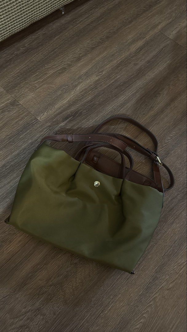 Legato Largo Hand Bag in Olive (Category: Luxury Bags & Wallets) located in Manila. Submitted by kimberlycryztal (Listing ID 1461538848, Image 1). Description: - Olive green Longchamp tote bag - Genuine leather handles and strap - Secure zipper closure - Ample interior space for all your essentials - Includes a detachable shoulder strap for versatile carrying - Elegant gold hardware details - Ideal for everyday use or travel.
