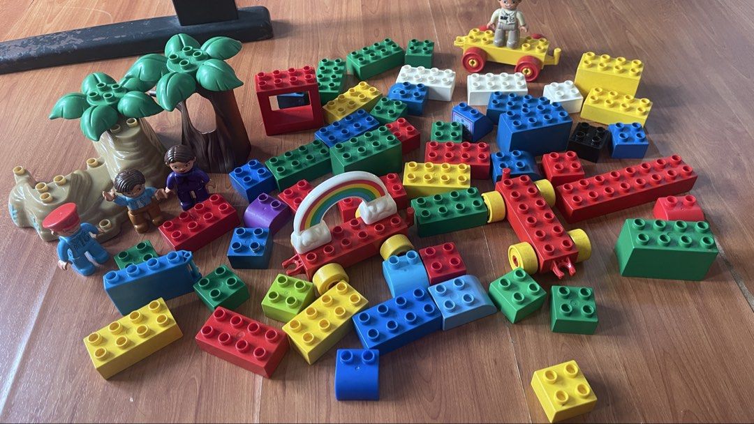 LEGO DUPLO Building Blocks Set with Figures and Accessories (Category: Lego & Building Sets) located in Rizal. Submitted by annelimited_stuffs (Listing ID 1461412206, Image 2). Description: - 128pcs Large collection of LEGO DUPLO blocks - Includes various bricks, figures, trees, and a rainbow piece - Comes with a yellow car base with wheels - Encourages imaginative play and building - Plenty of pieces for hours of fun - Ideal for young children t