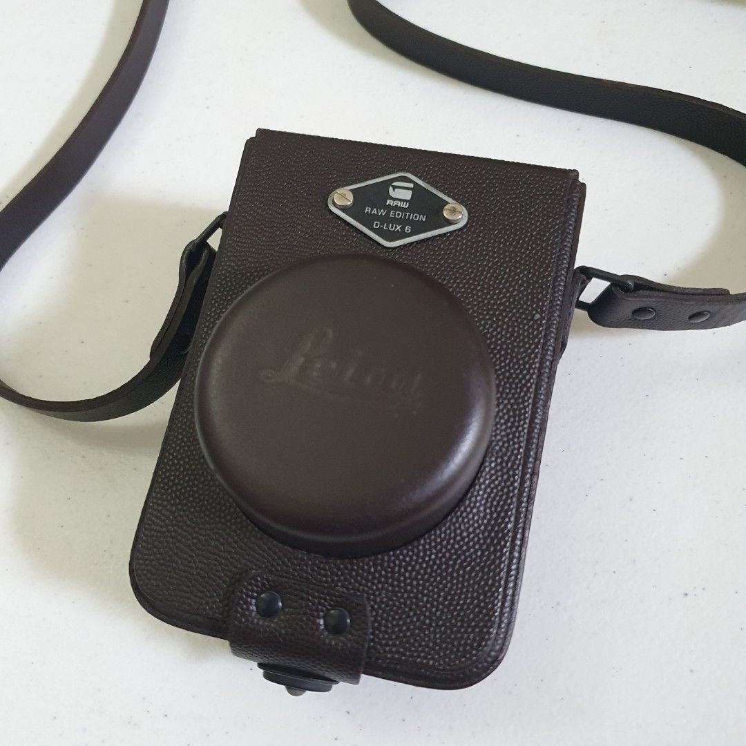 Leica D-LUX 6 RAW EDITION Leather Camera Case with Strap (Category: Camera Bags & Carriers) located in Paranaque City. Submitted by cobien (Listing ID 1461450465, Image 1). Description: - Genuine brown leather camera case - Specifically for Leica D-LUX 6 RAW EDITION - Includes a matching leather strap - Soft interior lining for camera protection - Stylish and practical for everyday carrying.