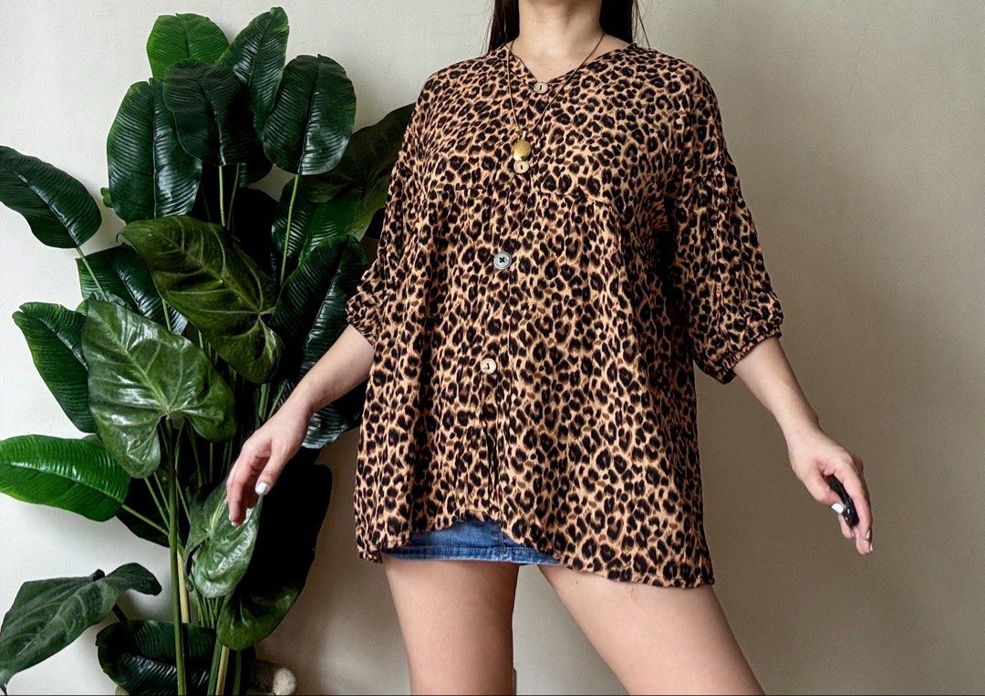 Leopard Print Button-Up Blouse Top,l to xxl (Category: Blouses) located in Mandaluyong City. Submitted by roxieeeeeee (Listing ID 1461498868, Image 2). Description: - Cute leopard print - V-neck with button details - Loose fit - Short sleeves - Versatile for casual outfits with shorts or jeans ✅ Like new condition ✅ Ships 1 day after payment ✅ Please allow 1 day for preparation (wash, dry, iron) Items are ready to wear upon arrival ✅ Payment cut-