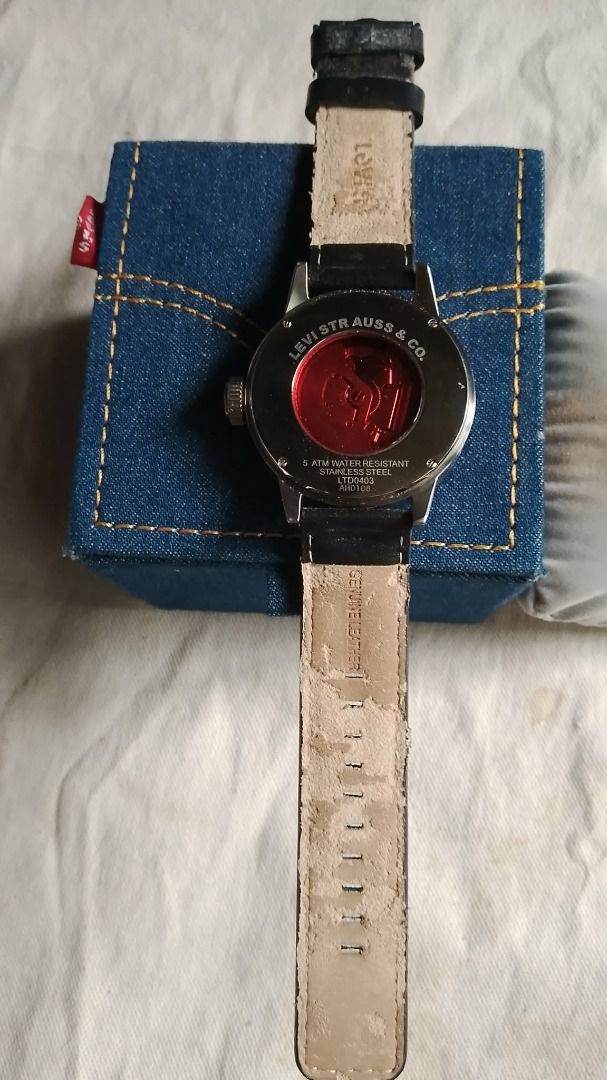 Levi Strauss & Co. LTD0403 (Category: Luxury Watches) located in Manila. Submitted by balaiheritage.ph (Listing ID 1461505233, Image 2). Description: Selling my Levi Strauss & Co. LTD0403 analog watch with its original Levi’s denim-style presentation box. The watch features a distinctive black dial with orange numerals, black leather strap with orange stitching, stainless-steel case, and classic Levi’s styling. A nice piece for collectors, Levi’s