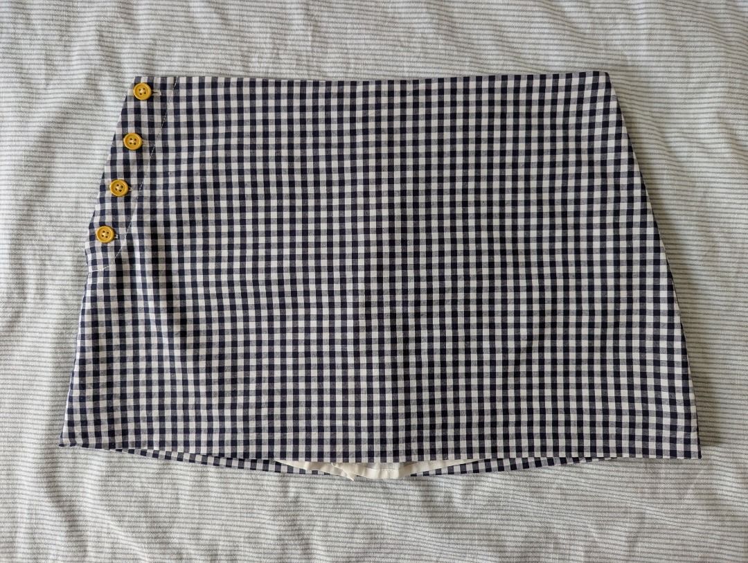 LIBÉ WORKSHOP Gingham Checked Side-Button Wrap Skort (Navy/White) - Thai Boutique [Size: M] (Category: Skirts) located in Cebu City. Submitted by anemonemone (Listing ID 1461427187, Image 1). Description: Color: Dark Navy Blue and Crisp White Gingham Checks with Mustard Yellow buttons Decluttering..