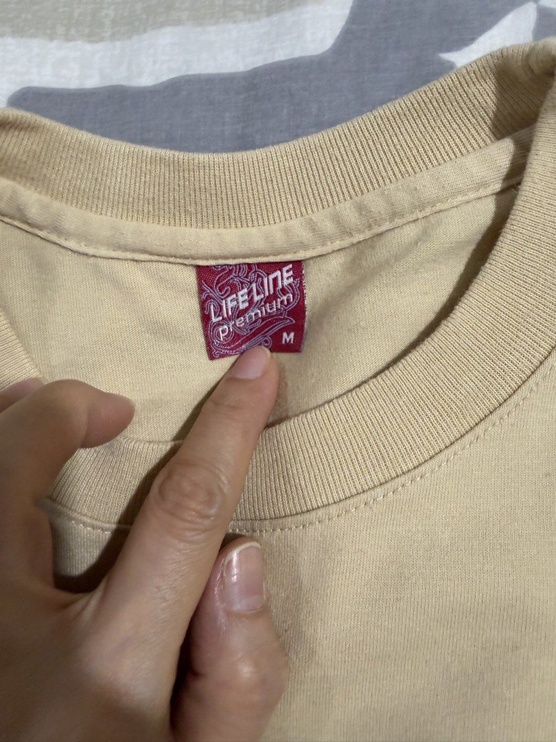 Life Line Premium T-shirt Size M (Category: Tshirts & Polo Shirts ) located in Mandaluyong City. Submitted by kqloset (Listing ID 1461450111, Image 2). Description: - Brand: Life Line Premium - Color: Beige - Size: Medium (M) - Style: Basic, comfortable t-shirt - Versatile: Great for everyday wear, layering, or wearing on its own - Details: Refer to tag in photos for more information.