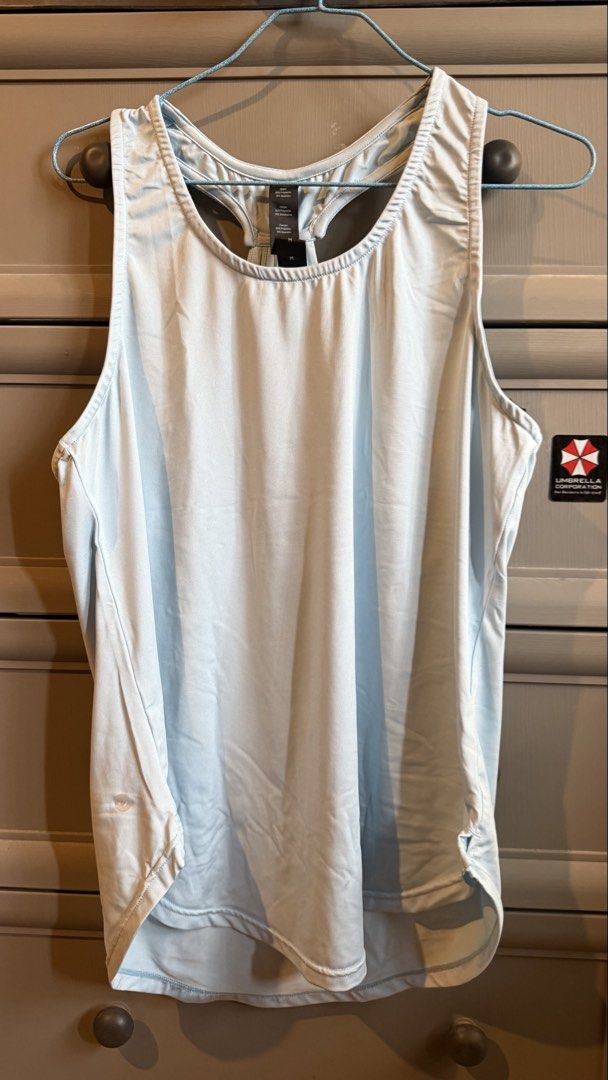 Light Blue Racerback Tank Top (Category: Sleeveless) located in La Trinidad. Submitted by kijupiter.ph (Listing ID 1461460462, Image 1). Description: - Light blue athletic tank top - Racerback design with multiple back straps - Lightweight and breathable fabric - Ideal for workouts or casual wear - Features a slight high-low hem Shipping via LBC (fixed ₱150) - please check my other latest listings if you’d like any other items to save on shipping