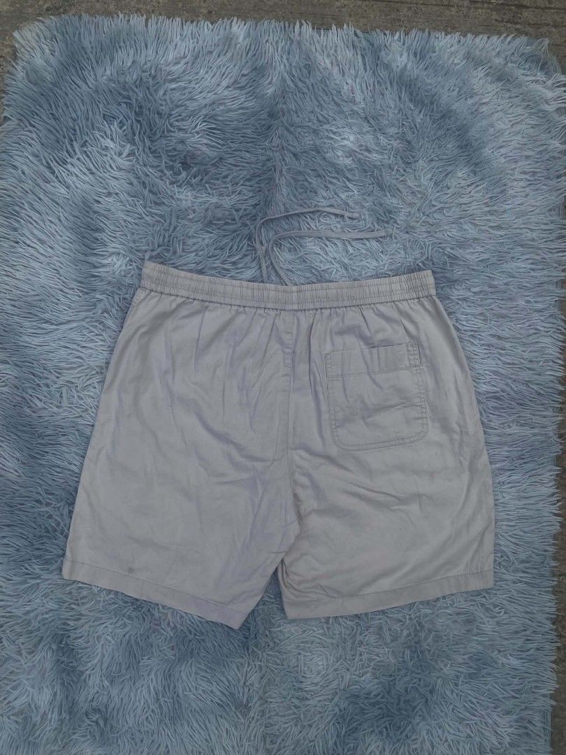 Light Grey Drawstring Shorts (Category: Shorts) located in Lianga. Submitted by arwthrifts (Listing ID 1461469035, Image 2). Description: - Comfortable light grey shorts - Elastic waistband with drawstring for adjustable fit - Two side pockets and one back pocket - Perfect for lounging or casual outings - Note: Some faint marks visible on fabric.