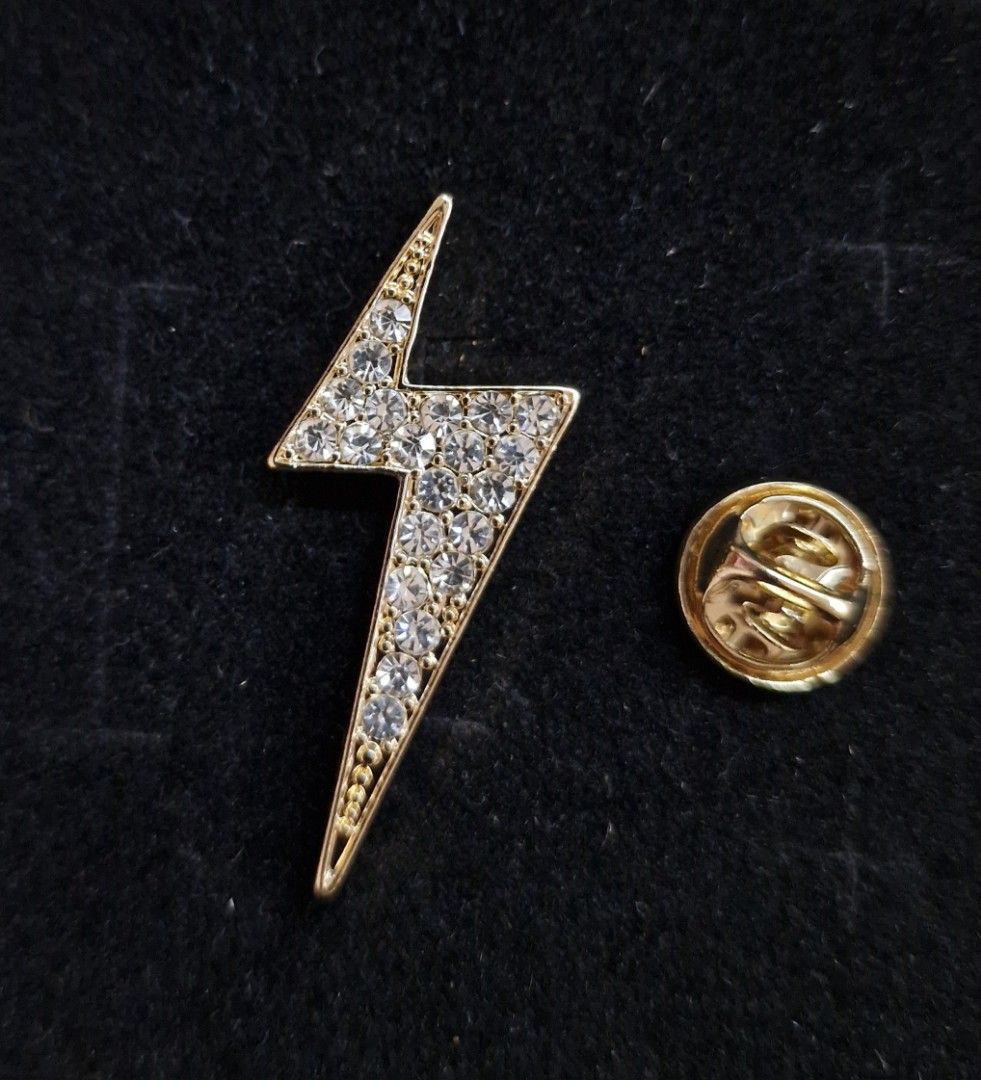 Lightning Bolt Brooch (Category: Brooches) located in Taguig. Submitted by mommaschoice (Listing ID 1461362769, Image 1). Description: Brand New Secure Pin Design Adorned w/ white rhinestones Gold-Tone finish Ships nationwide.