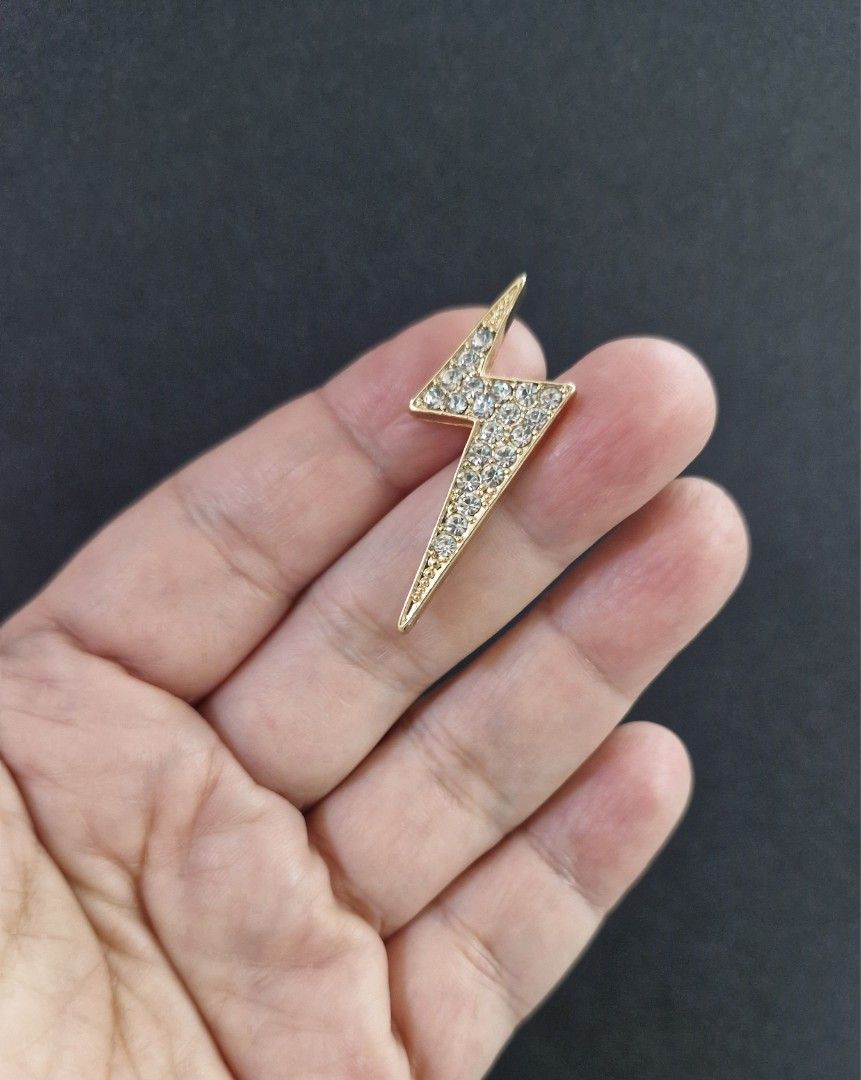 Lightning Bolt Brooch (Category: Brooches) located in Taguig. Submitted by mommaschoice (Listing ID 1461362769, Image 2). Description: Brand New Secure Pin Design Adorned w/ white rhinestones Gold-Tone finish Ships nationwide.