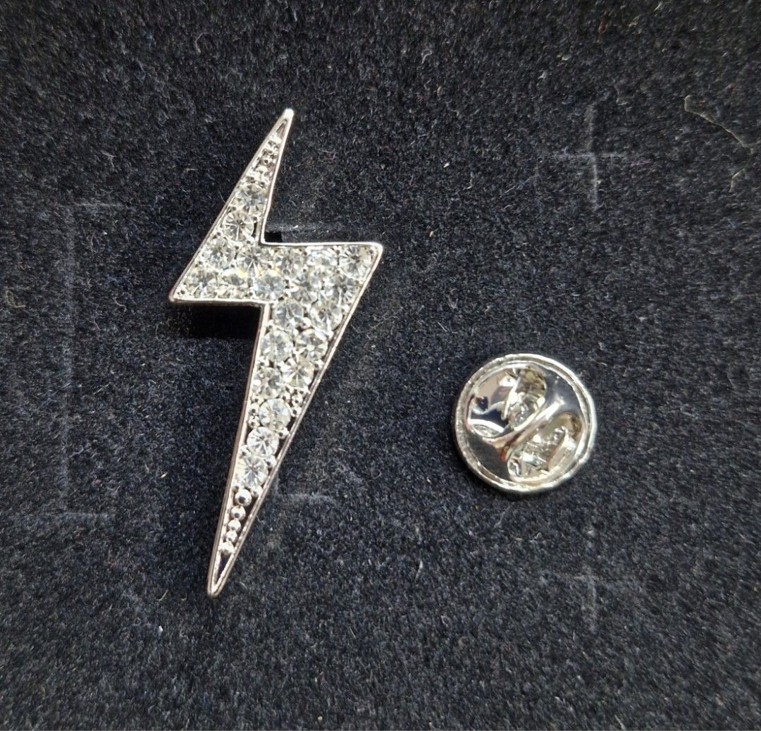 Lightning Bolt Brooch 2 (Category: Brooches) located in Taguig. Submitted by mommaschoice (Listing ID 1461363096, Image 1). Description: Brand New Secure Pin Design Adorned w/ white rhinestones Perfect for ties, suits, jackets , caps Ships nationwide.