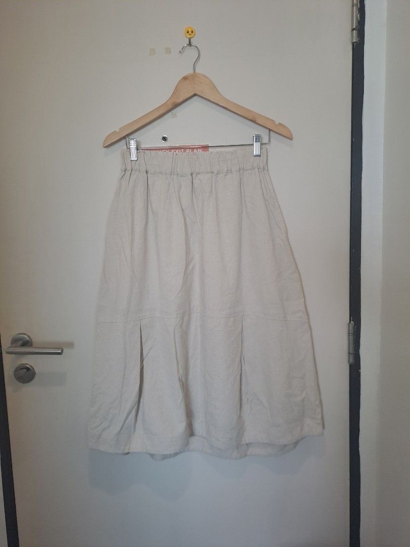 Linen skirt beige (Category: Skirts) located in Manila. Submitted by joanbalde39643 (Listing ID 1461384165, Image 2). Description: a beige linen-blend midi skirt with a comfortable elasticated waistband and subtle inverted box pleats near the lower hem. Linen-blend midi skirts offer a breezy, relaxed aesthetic perfect for warm-weather styling.