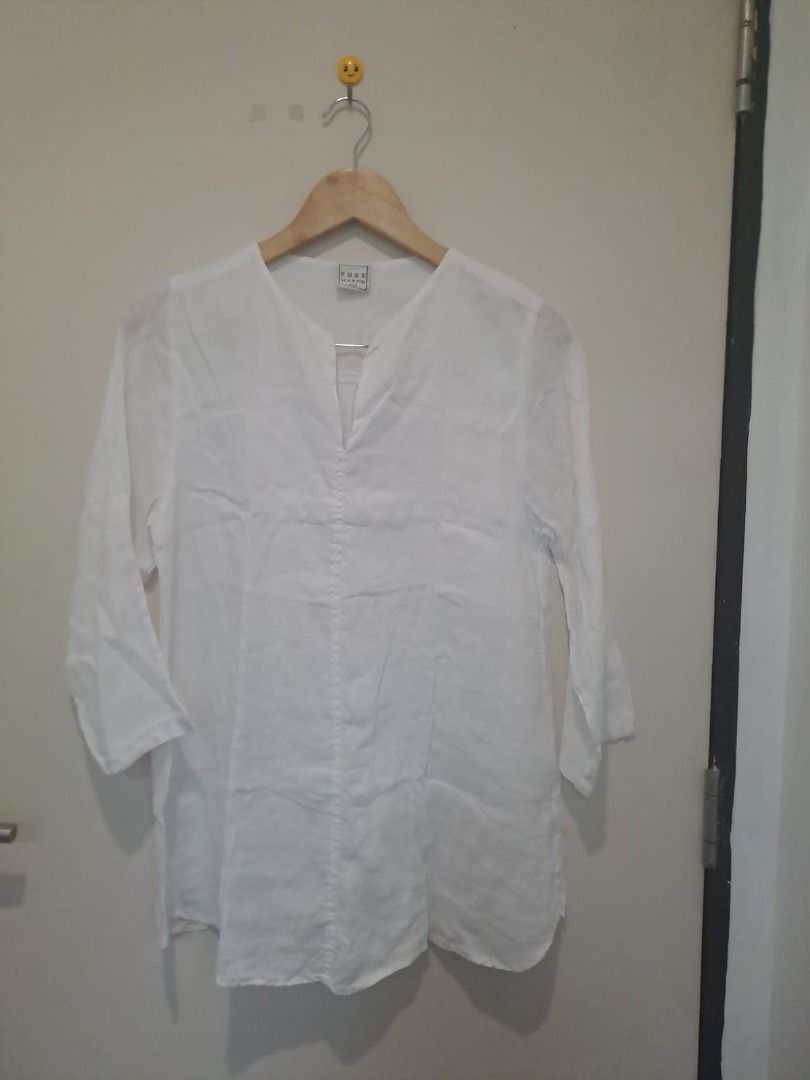 Linen tunic longsleeve (Category: Longsleeves) located in Mandaluyong City. Submitted by epicowl-c93c (Listing ID 1461348739, Image 1). Description: This garment is a women's white linen tunic blouse, featuring a relaxed fit, a split V-neckline, and versatile three-quarter length sleeves..