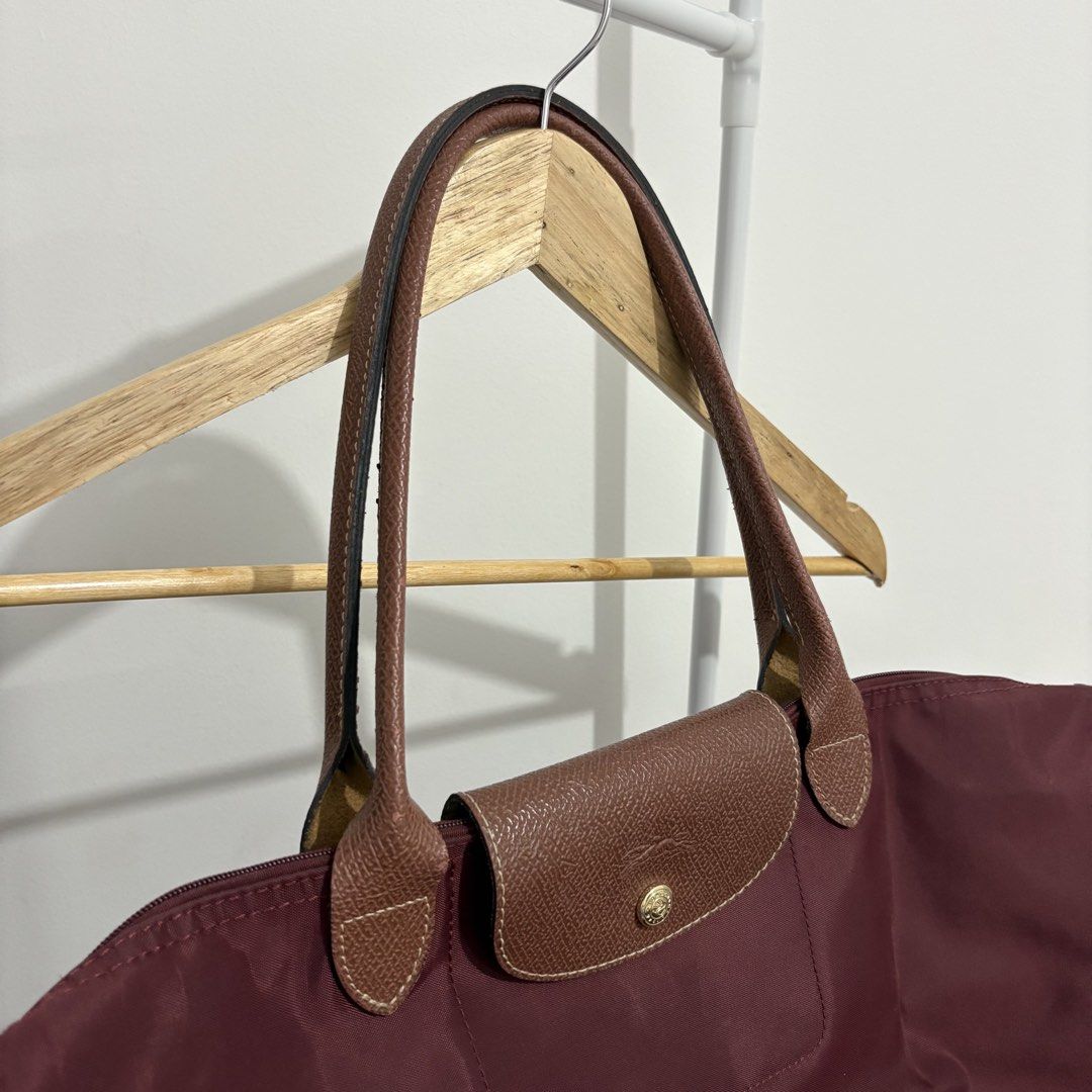 Longchamp - Le Pliage Tote Bag (Burgundy, Large) (Category: Luxury Bags & Wallets) located in Quezon City. Submitted by thisisshobe (Listing ID 1461478956, Image 3). Description: 🌊 NOTE: Kindly read the reminders posted in the product slideshow. Follow us on our Social Media Page: Sunny Clothing PH 🌞 ——— 💫 Product Information • Brand: Longchamp • Size: Large • Details: Vietnam-made only; Has visible small flaws.