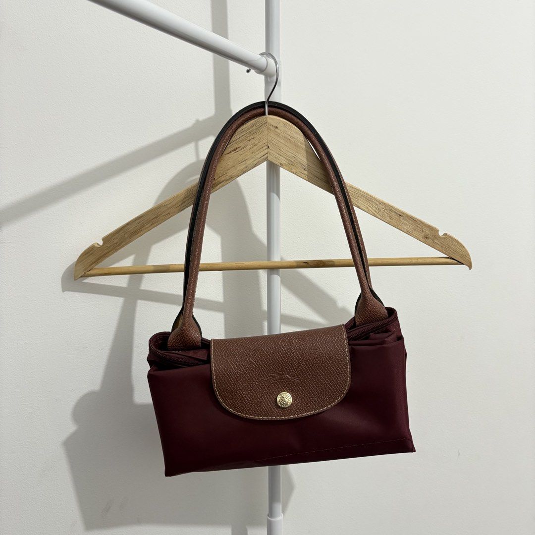 Longchamp - Le Pliage Tote Bag (Burgundy, Large) (Category: Luxury Bags & Wallets) located in Quezon City. Submitted by thisisshobe (Listing ID 1461478956, Image 1). Description: 🌊 NOTE: Kindly read the reminders posted in the product slideshow. Follow us on our Social Media Page: Sunny Clothing PH 🌞 ——— 💫 Product Information • Brand: Longchamp • Size: Large • Details: Vietnam-made only; Has visible small flaws.