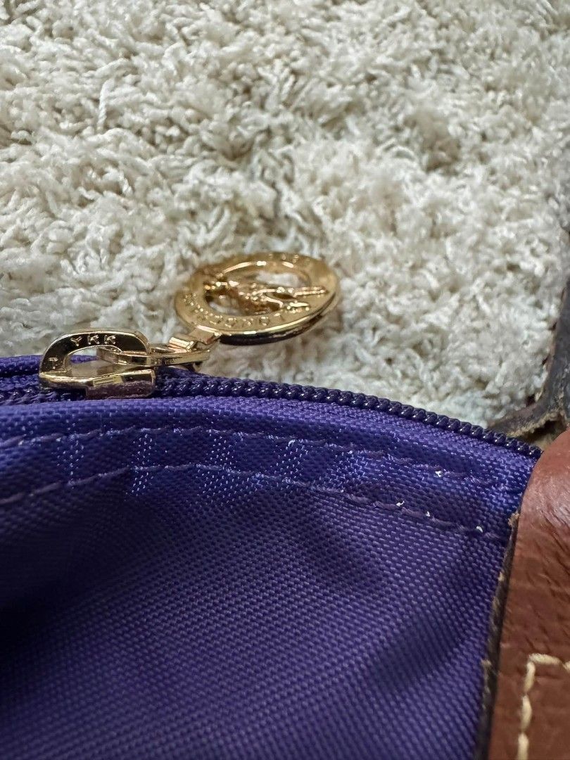 Longchamp Paris Le Pliage Tote Bag (Category: Luxury Bags & Wallets) located in Manila. Submitted by shy177 (Listing ID 1461384169, Image 3). Description: - Authentic Longchamp Paris Le Pliage tote bag - Made in Tunisia - Vibrant purple color with brown leather accents - Zipper closure - Ideal for everyday use or travel - Spacious interior.