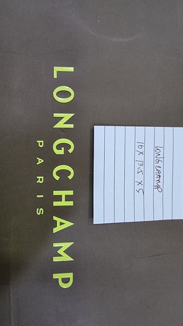 Longchamp Paris Shopping Bag (Category: Luxury Bags & Wallets) located in Paranaque City. Submitted by olxph_668280920 (Listing ID 1461475155, Image 3). Description: - Authentic Longchamp Paris shopping bag - Color: Dark Green - Size: 16 x 13.5 x 5 inches - Features sturdy handles - Ideal for shopping or as a gift bag.