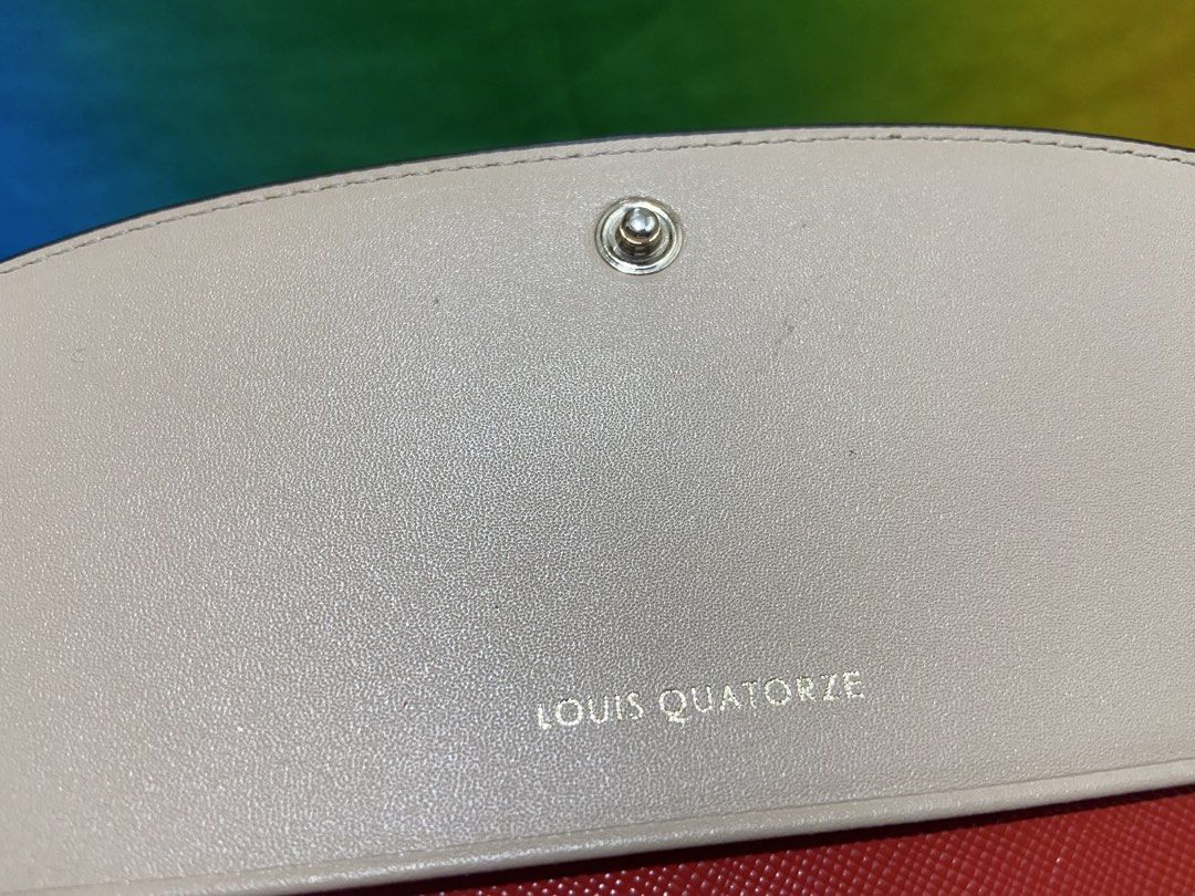 Louis Quatorze Red Leather Long Wallet (Category: Wallets & Card holders) located in Pasig City. Submitted by jie_russ (Listing ID 1461425432, Image 3). Description: - Authentic Louis Quatorze red leather long wallet - Elegant gold emblem on the front - Beige interior with stylish red accents - Ample card slots and compartments for organization - Secure and convenient snap closure.