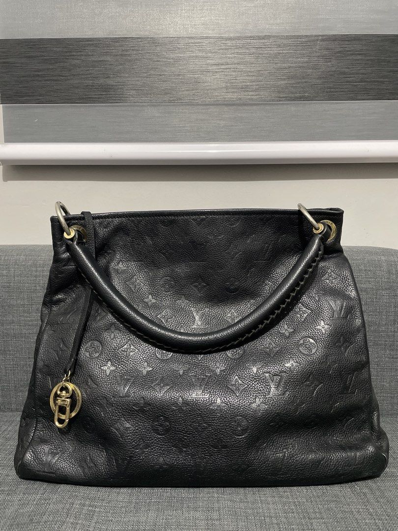 Louis Vuitton Black Monogram Leather Shoulder Bag (Category: Luxury Bags & Wallets) located in Pasig City. Submitted by roseyyylife (Listing ID 1461469214, Image 1). Description: Black Louis Vuitton shoulder bag. Textured leather with embossed monogram pattern. Braided handle detail. Gold hardware, including a LV charm. Zipper closure. Interior is clean. Great everyday bag..