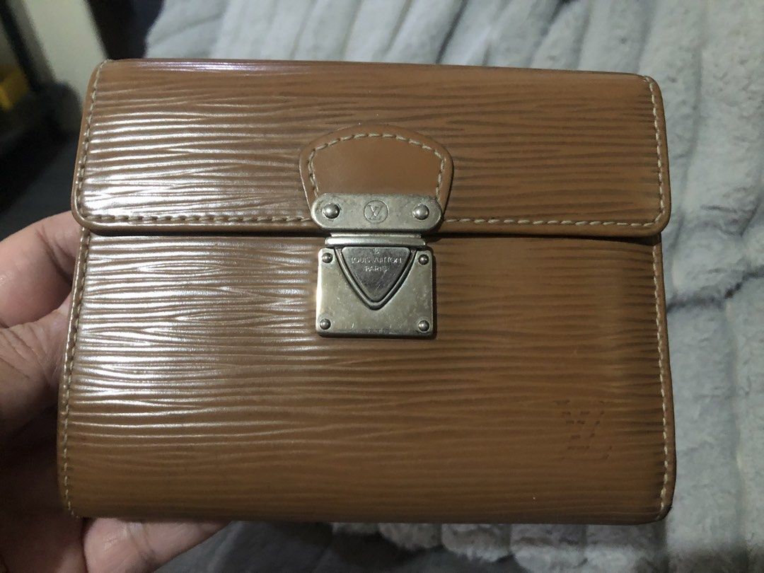 Louis Vuitton Epi Leather Wallet (Category: Luxury Bags & Wallets) located in Angeles City. Submitted by vilma43 (Listing ID 1461507542, Image 1). Description: - Authentic Louis Vuitton wallet - Rich brown Epi leather - Secure snap closure - Convenient zippered coin pocket - Multiple interior card slots - Shows some signs of wear, adding character - Fully functional and a timeless accessory.