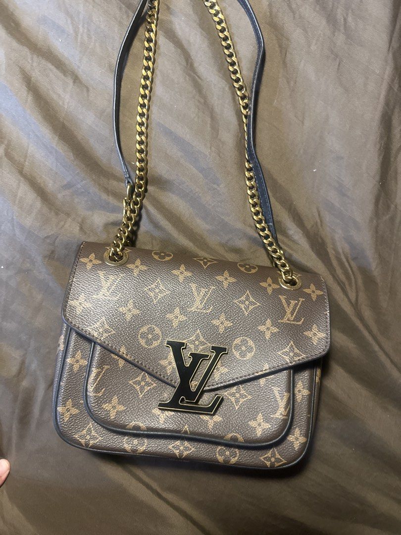 Louis Vuitton Monogram Chain Shoulder Bag (Category: Luxury Bags & Wallets) located in Pasig City. Submitted by the_bag_agent (Listing ID 1461409451, Image 1). Description: - NGA Classic Louis Vuitton monogram shoulder bag - Features a gold chain strap - Iconic LV logo on the front flap - Interior lined with deep pink material - Includes an internal zip pocket - Secure front flap closure - Versatile for everyday use or special occasions.