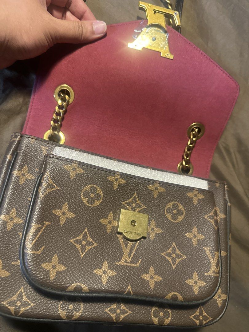 Louis Vuitton Monogram Chain Shoulder Bag (Category: Luxury Bags & Wallets) located in Pasig City. Submitted by the_bag_agent (Listing ID 1461409451, Image 3). Description: - NGA Classic Louis Vuitton monogram shoulder bag - Features a gold chain strap - Iconic LV logo on the front flap - Interior lined with deep pink material - Includes an internal zip pocket - Secure front flap closure - Versatile for everyday use or special occasions.