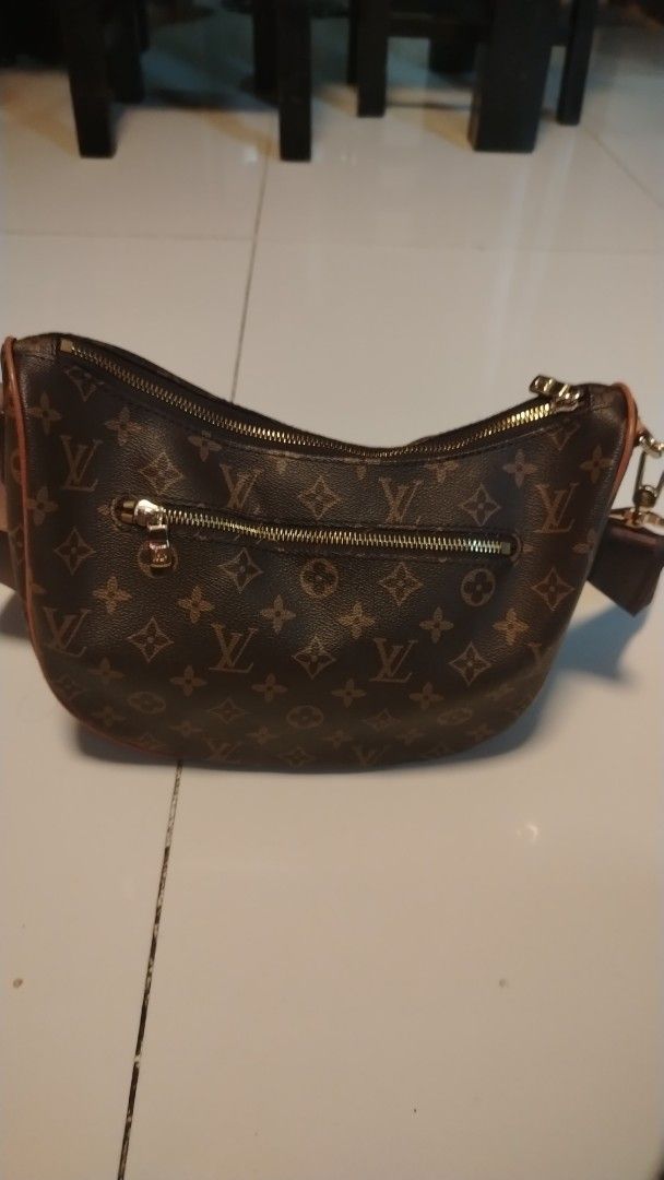 Louis Vuitton Monogram Crescent Bag (Category: Luxury Bags & Wallets) located in Manila. Submitted by wildwind_73f77a (Listing ID 1461504259, Image 3). Description: - Classic Louis Vuitton monogram crescent bag - Chic and versatile design - Main zip compartment and external zip pocket - Adjustable strap with Louis Vuitton branding - Elegant gold hardware details - Ideal for everyday use or evening outings.