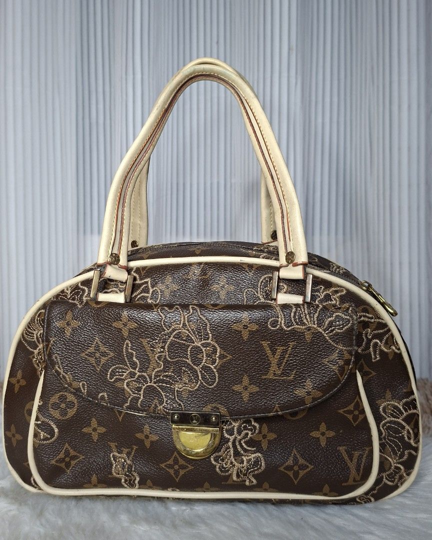 Louis Vuitton Monogram Embroidered Handbag (Category: Luxury Bags & Wallets) located in Nabua. Submitted by alasaasche36553 (Listing ID 1461433287, Image 2). Description: - Rare Brown Louis Vuitton Monogram Handbag - Features intricate floral embroidery on front flap and sides - Beige leather handles and trim - Gold-tone hardware with front clasp closure - Zipper closure along the top - A stylish and unique statement piece.