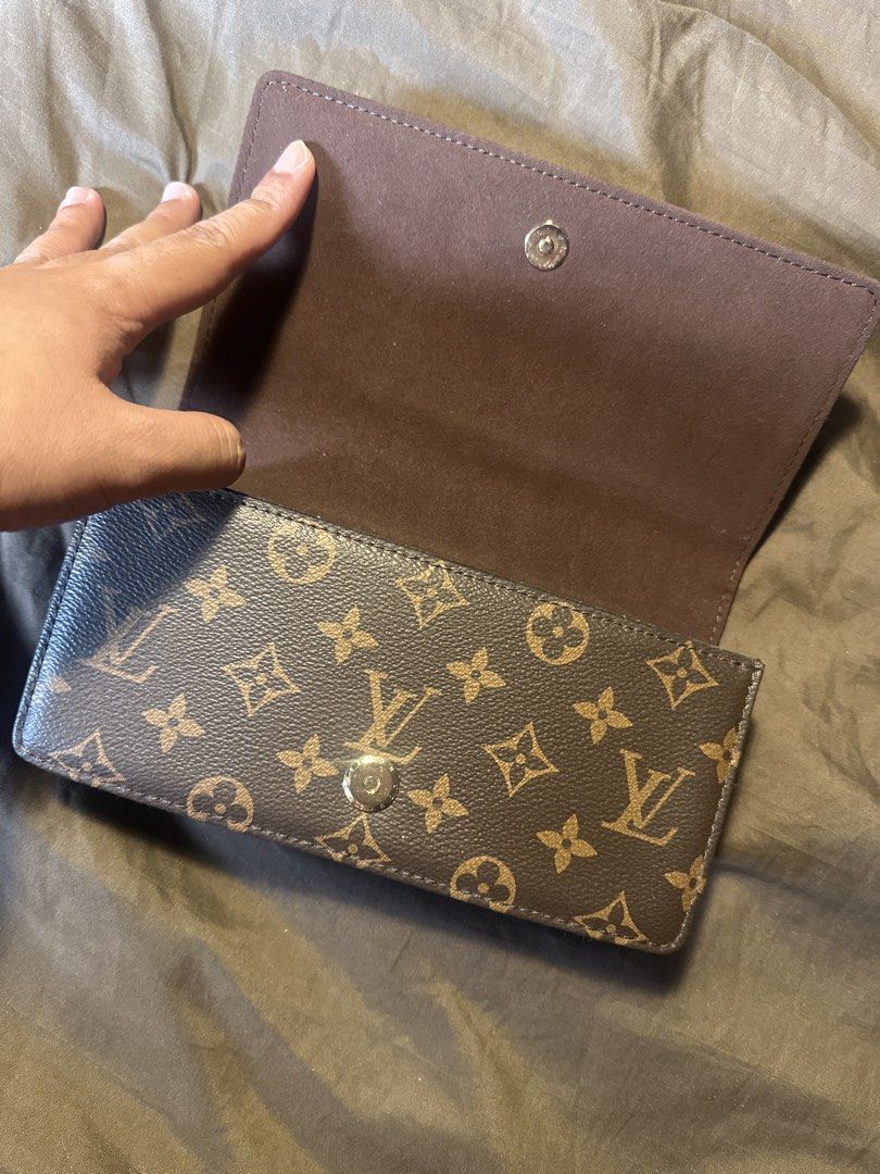 Louis Vuitton Monogram Wallet with Gold Chain (Category: Luxury Bags & Wallets) located in Pasig City. Submitted by the_bag_agent (Listing ID 1461410642, Image 2). Description: - NGA Classic Louis Vuitton monogram wallet - Color: Brown canvas with gold hardware - Detachable gold chain strap included - Spacious interior for cards and cash - Secure snap closure - Versatile: Use as a clutch or for nights out.