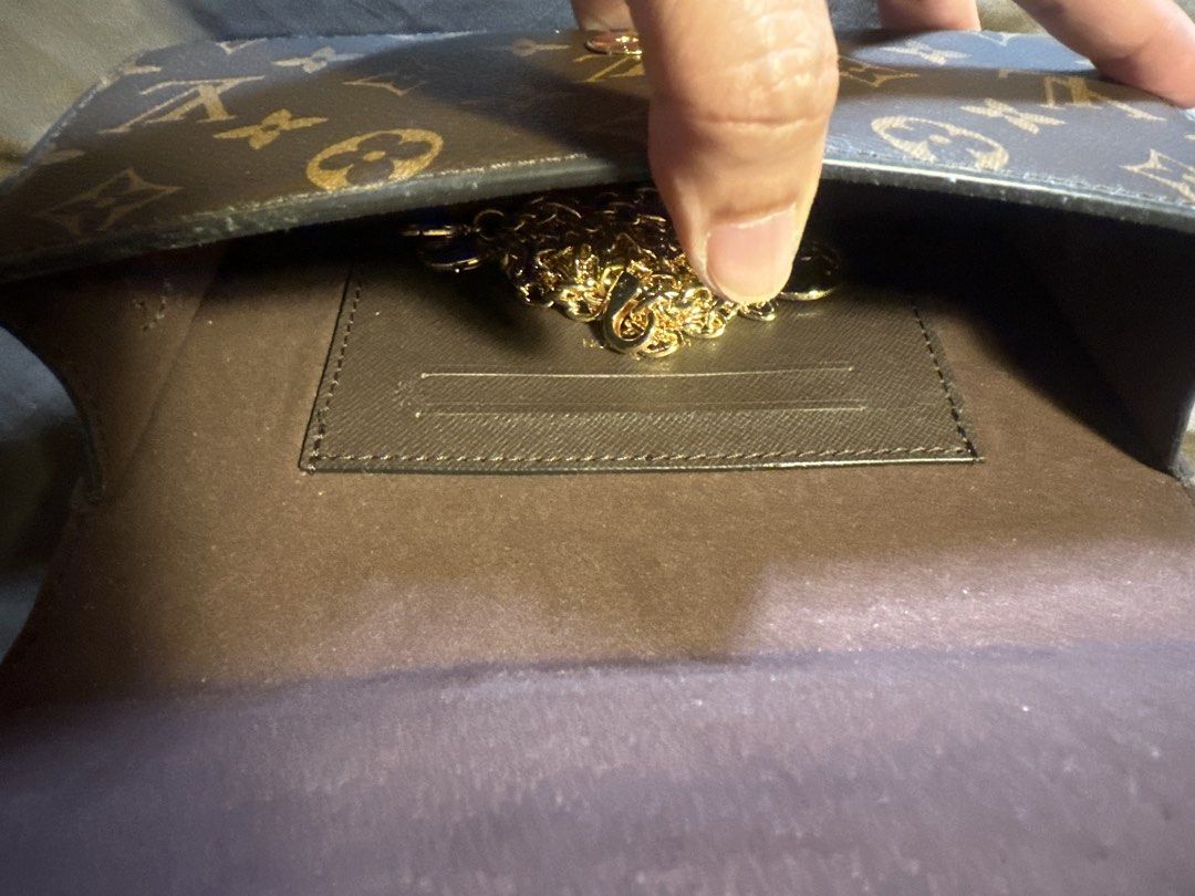 Louis Vuitton Monogram Wallet with Gold Chain (Category: Luxury Bags & Wallets) located in Pasig City. Submitted by the_bag_agent (Listing ID 1461410642, Image 3). Description: - NGA Classic Louis Vuitton monogram wallet - Color: Brown canvas with gold hardware - Detachable gold chain strap included - Spacious interior for cards and cash - Secure snap closure - Versatile: Use as a clutch or for nights out.