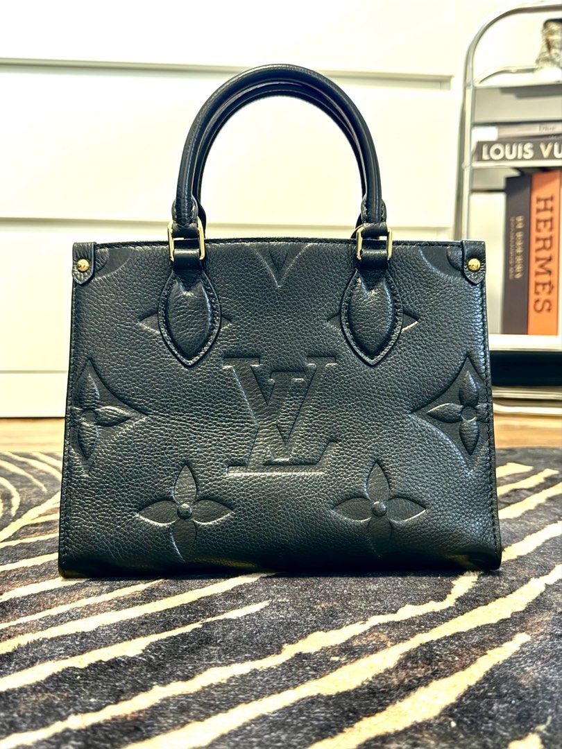 Louis Vuitton OnTheGo PM Monogram Empreinte Black (Category: Luxury Bags & Wallets) located in Manila. Submitted by jaderules (Listing ID 1461410314, Image 3). Description: * Louis Vuitton black Empreinte leather handbag * Signature embossed Monogram pattern * Gold-tone hardware and top handles * Includes original LV dust bag and booklet * Includes detachable strap * Excellent pre-owned condition with minor signs of use.