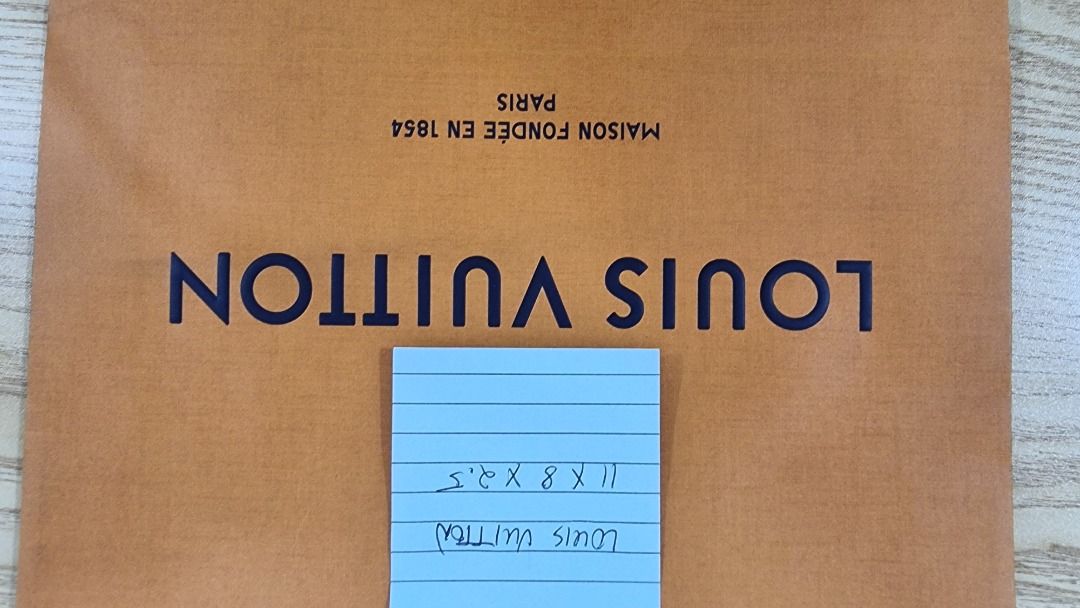 Louis Vuitton Shopping Bag (Category: Luxury Bags & Wallets) located in Paranaque City. Submitted by olxph_668280920 (Listing ID 1461474536, Image 3). Description: - Authentic Louis Vuitton shopping bag - Color: Brown paper with blue handles - Dimensions: 11 x 8 x 3.5 inches - Features: "Maison fondée en 1854 Paris" - Ideal for: Storing small items or as a gift bag.