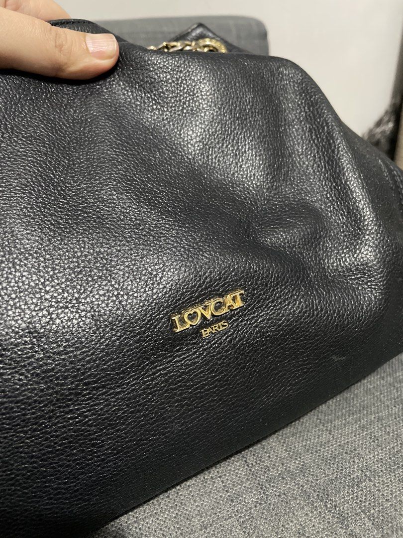 LOVCAT Paris Black Leather Chain Shoulder Bag (Category: Shoulder Bags) located in Pasig City. Submitted by roseyyylife (Listing ID 1461455943, Image 3). Description: - LOVCAT Paris black leather shoulder bag - Elegant gold chain detailing and straps - Spacious interior with a zippered pocket - Branded LOVCAT Paris tag inside - Ideal for everyday essentials and a classic look.
