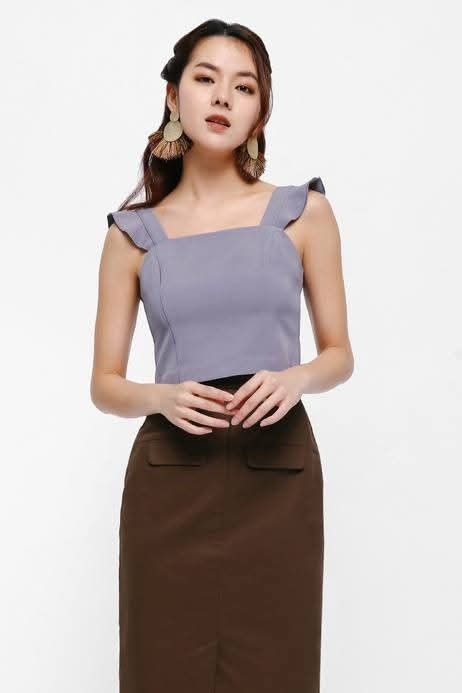 Love Bonito Chadwick Flutter Strap Fitted Crop Top (Category: Sleeveless) located in Manaoag. Submitted by dressupdear (Listing ID 1461349035, Image 1). Description: Size: Medium We're obsessed with fitted crop tops lately - they require no tucking in fuss and fit closely to the frame, lending our silhouettes a smart sleekness when paired with a high-waisted bottom. Flutter straps add a fun anc feminine touch. Exposed open-end back zip closure wi