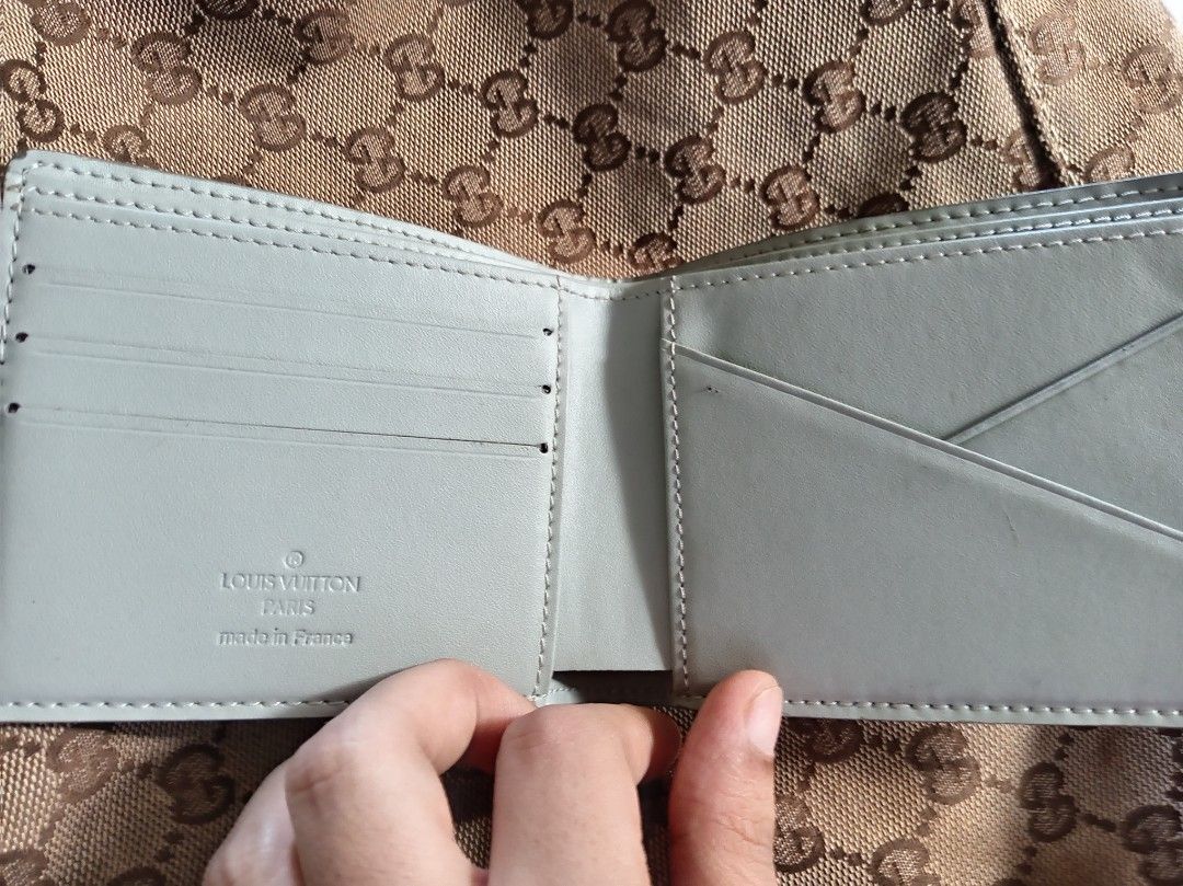 LV wallet (Category: Luxury Bags & Wallets) located in Malolos. Submitted by shoptokyothrift (Listing ID 1461386862, Image 3). Description: Louis Vuitton Compact Wallet 🤍 • White/Light Grey Monogram • Compact bifold design • Multiple card slots & compartments • Made in France stamping • Preloved, good condition • See photos for actual condition.