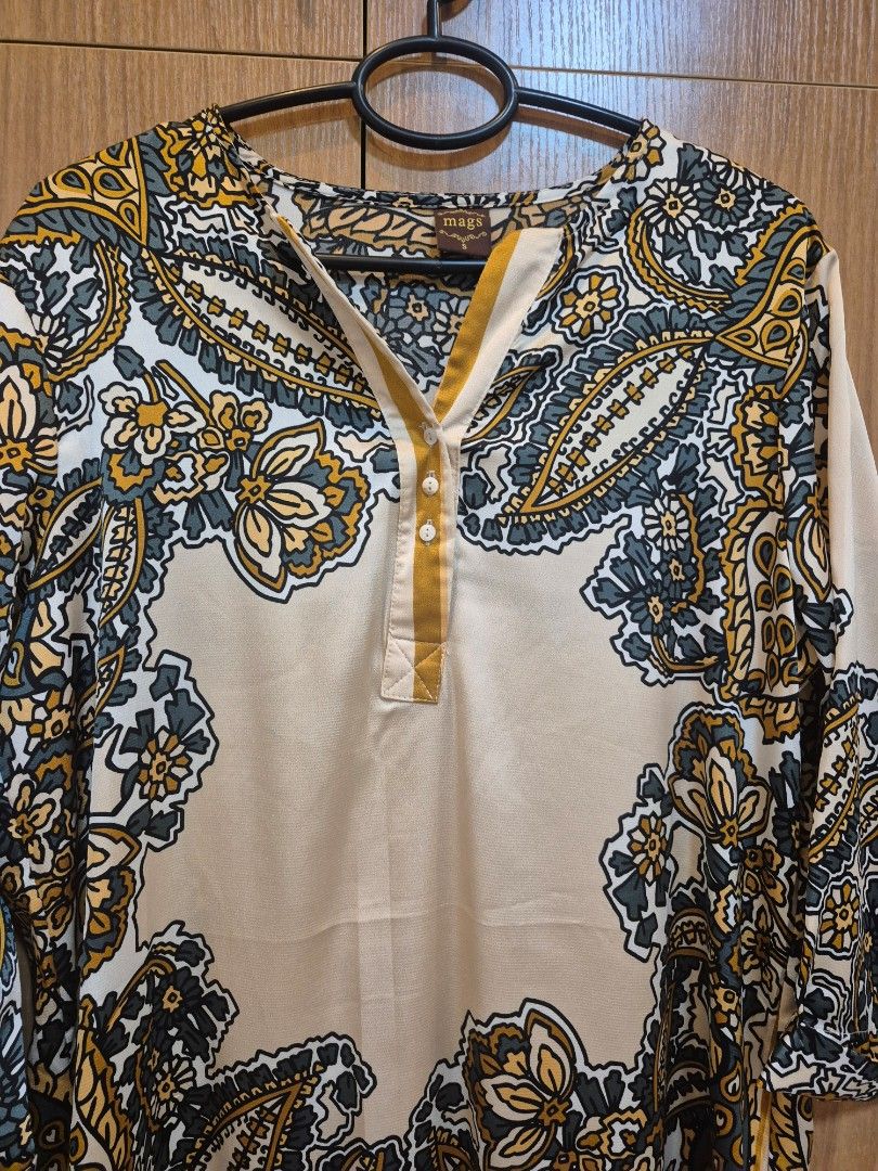 Mags Paisley Print Button-Up Blouse (Category: Blouses) located in Las Pinas. Submitted by shinecandaba (Listing ID 1461479246, Image 2). Description: - Cream colored dress - Bold paisley print - Button-up front - Small collar detail - Long sleeves - Fabric with a slight sheen - Versatile for casual or dressing up.