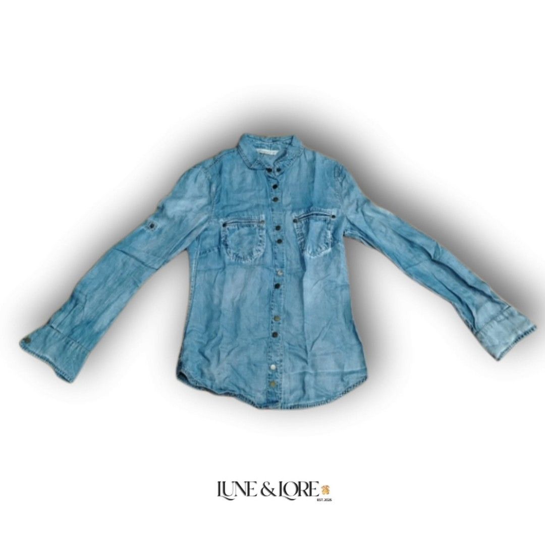 Mango Jeans Light Wash Denim Button-Down Shirt (Category: Longsleeves) located in Cavite. Submitted by lune.and.lore (Listing ID 1461335090, Image 1). Description: 𓏲𝄢 ┆ Mango Jeans Light Wash Denim Button-Down Shirt ♡ item code : NIN - 140 🀢 condition : brand new, no flaws, need wash 𖤝 size : xs - s (xs on tag) 𖤝 original price : ₱2,290 – ₱3,290 𖤝 price : sol ₱150 (au) 𓋜 MOD : J&T 𓋜 MOP : GCash ⚚ check highlights for terms and conditions 