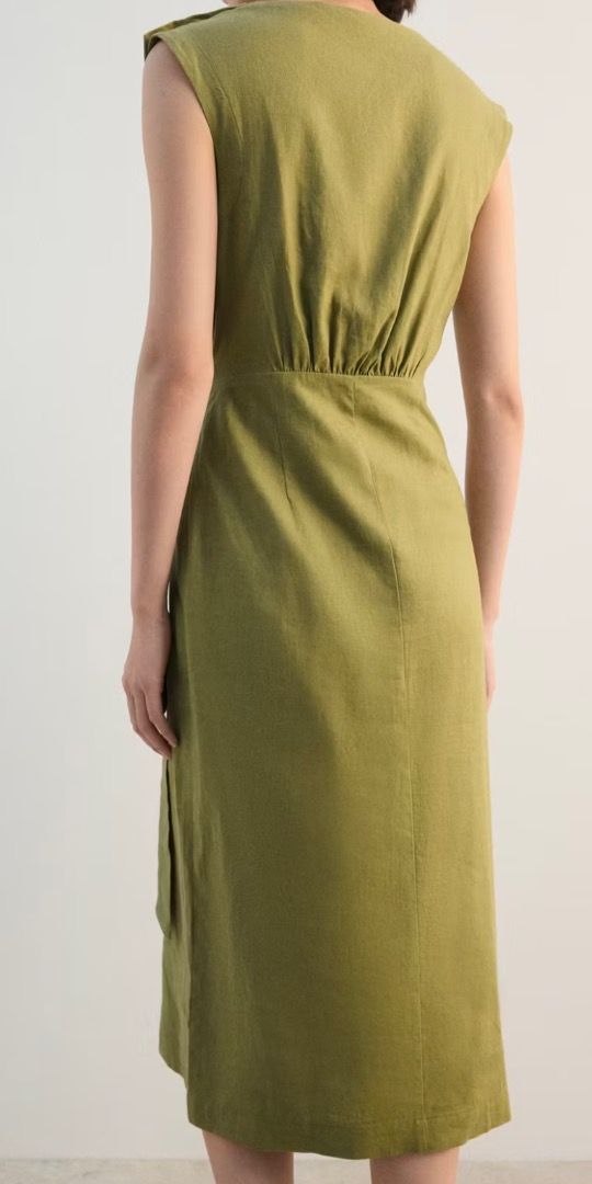 Mango Linen Wrap Dress - Olive Green (Category: Dresses) located in Mandaluyong City. Submitted by unworntobarelyworn (Listing ID 1461334595, Image 3). Description: - Brand new Mango linen wrap dress - Color: Olive Green - Style: Sleeveless, midi length - Features: Tie waist, button details on shoulder - Condition: Never worn - Versatile: Perfect for dressing up or office attire - Can fit XS to S - Original price P3,295.