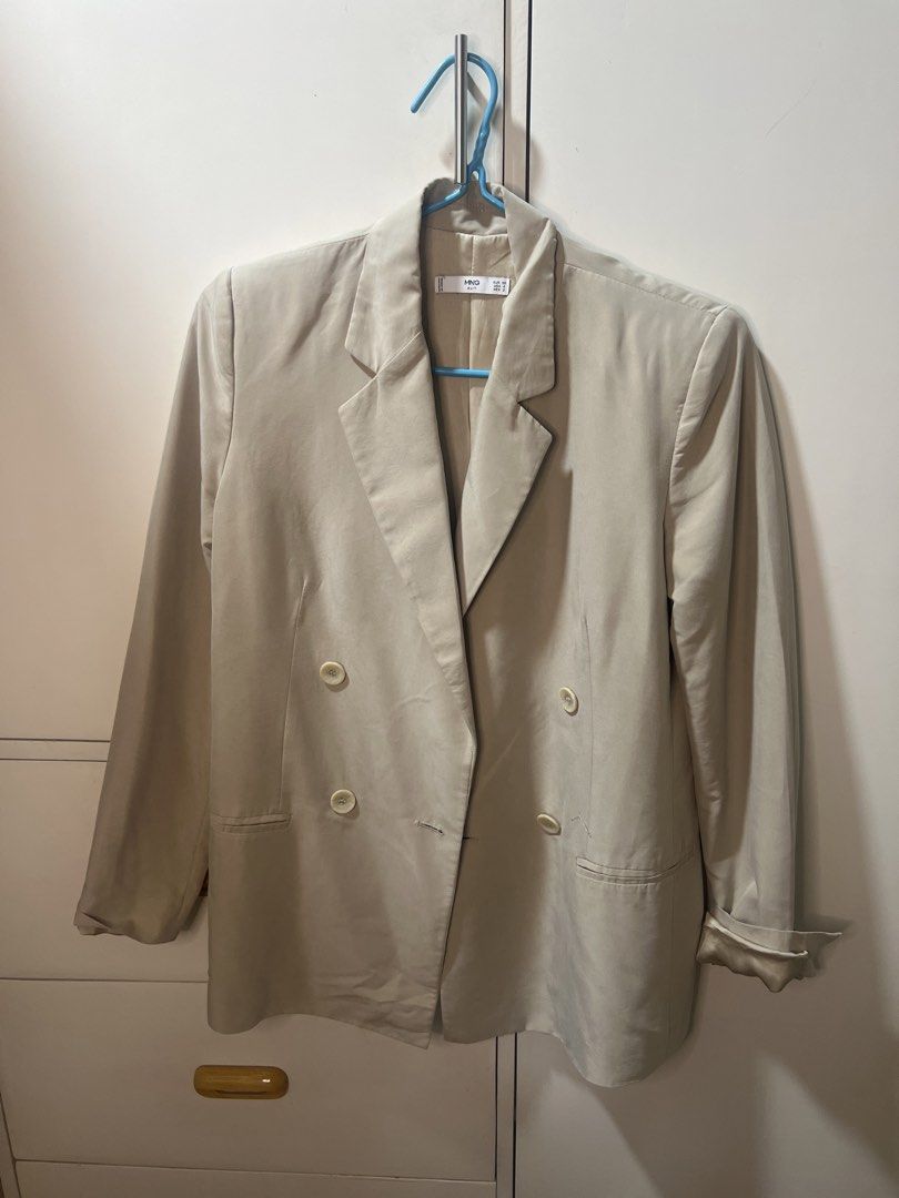 Mango Suit Double Breasted Blazer Beige (Category: Coats, Jackets and Outerwear) located in Calamba. Submitted by cdg02 (Listing ID 1461451000, Image 1). Description: - Mango Suit beige double-breasted blazer - Features two buttons in the front.
