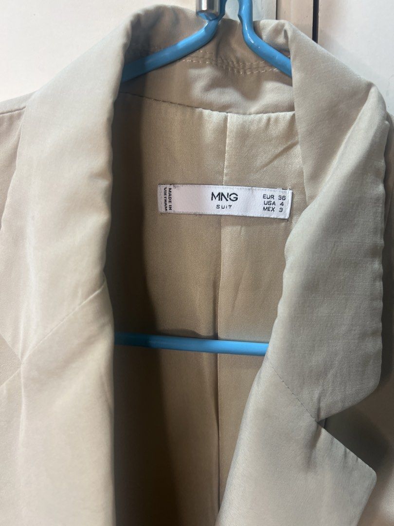Mango Suit Double Breasted Blazer Beige (Category: Coats, Jackets and Outerwear) located in Calamba. Submitted by cdg02 (Listing ID 1461451000, Image 2). Description: - Mango Suit beige double-breasted blazer - Features two buttons in the front.