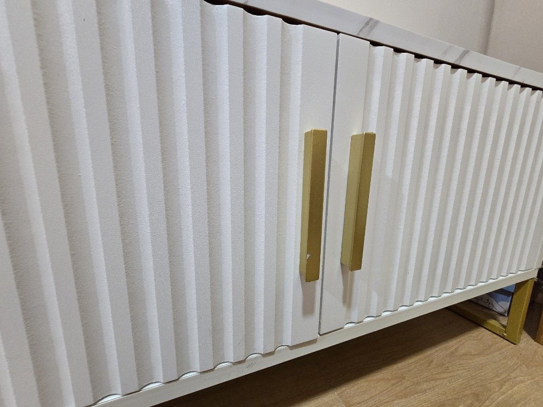 Marble White + Gold Classic Minimalist TV Rack (Category: TV Consoles) located in Quezon City. Submitted by lorenandi (Listing ID 1461348621, Image 3). Description: * 120 x 30 x 40cm * Already built * Used for 1 month only. Selling because will upgrade to a bigger one.