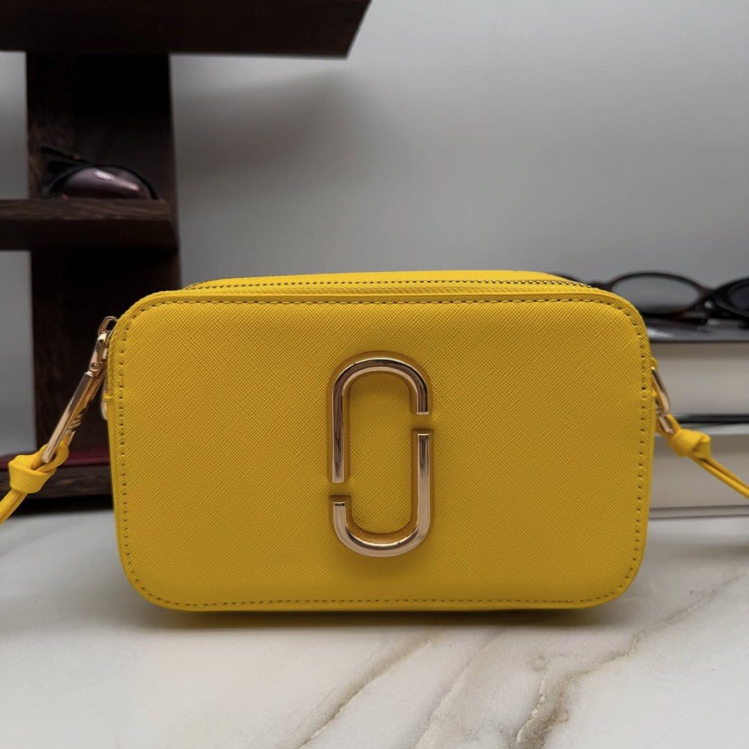Marc Jacobs The Snapshot Camera Cross Body Bag (Category: Cross-body Bags) located in Makati City. Submitted by lottielabouff (Listing ID 1461490403, Image 2). Description: Marc Jacobs The Snapshot Camera Cross Body Bag [PRICE] Bought in Farfetch for 425 USD (24,600 PHP) Selling for 8200 PHP • Selling my bags for affordable price • Price is still negotiable, drop your offer thru dm • No box, cards and papers, but i took detailed photos for you to